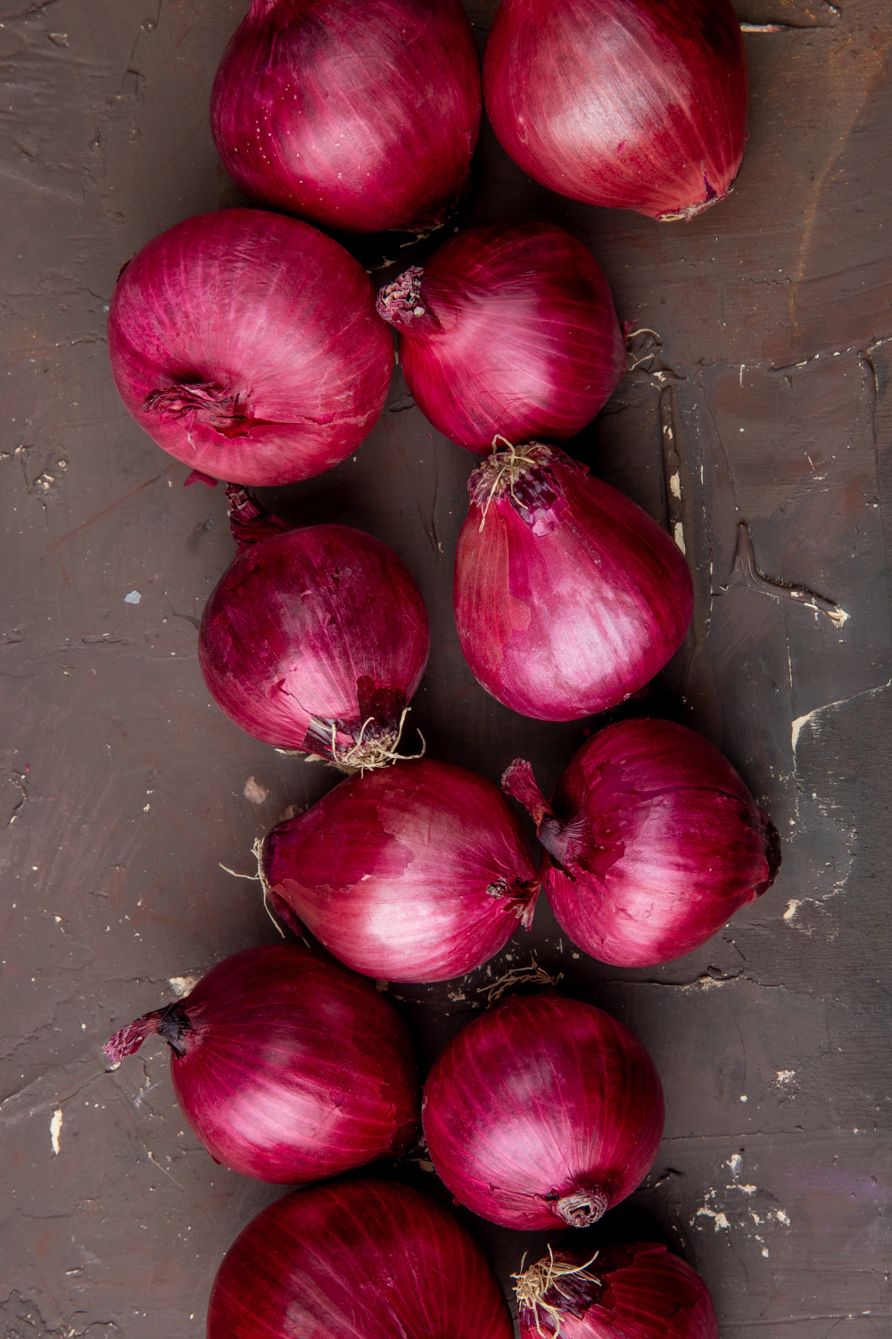 top-view-red-onions-maroon-background